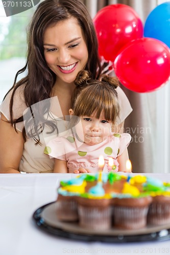 Image of Mother With Daughter Celebrating Birthday Party