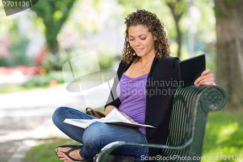 Image of University Student Reading Book