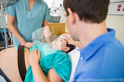 Image of Husband with Wife During Birth of Baby