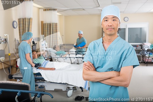 Image of Confident Male Nurse Standing In Ward