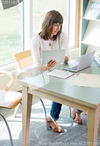 Image of Female Student Studying In Library