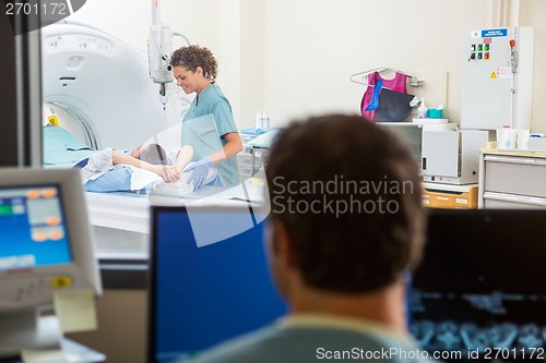 Image of Nurse Preparing Patient For CT Scan