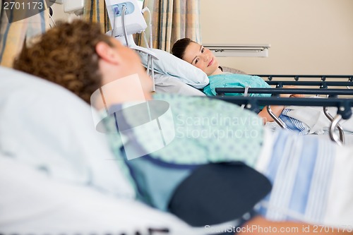 Image of Young Patient's Looking At Each In Hospital