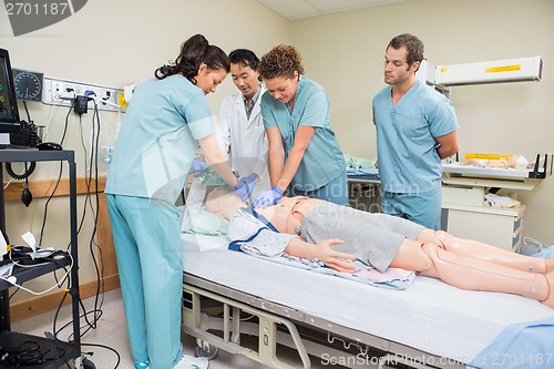 Image of Nurse Performing CPR On Dummy Patient