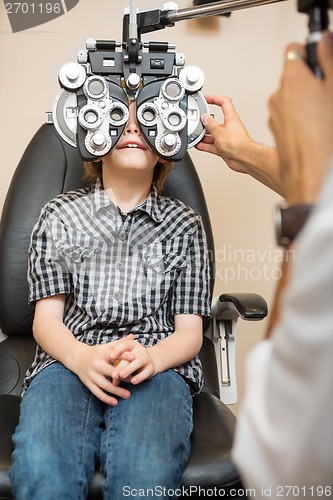 Image of Boy Undergoing Eye Examination With Phoropter