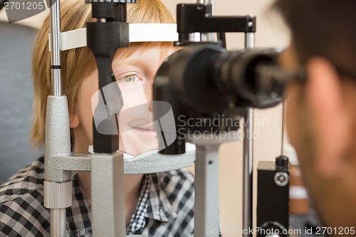 Image of Boy's Eyes Being Examined By Slit Lamp