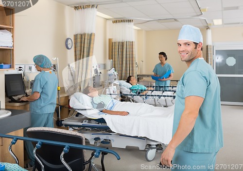 Image of Male Nurse Standing In Hospital PAR unit