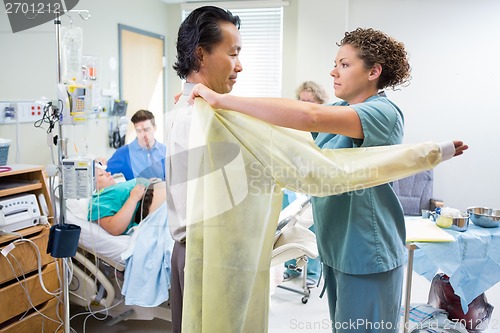 Image of Doctor Preparing to Deliver Baby in Hospital