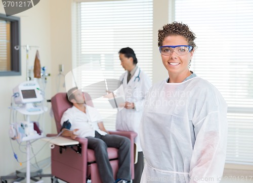 Image of Nurse With Doctor Examining Patient's Heartbeat In Hospital