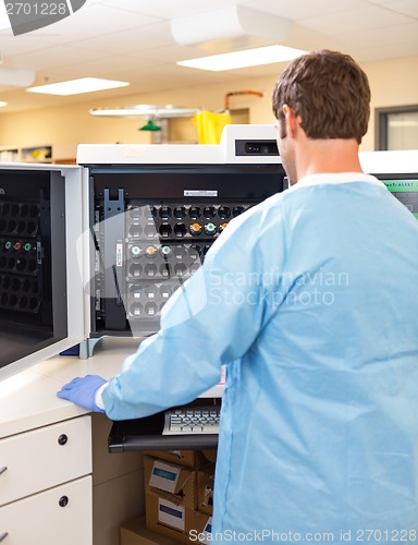 Image of Lab Tech Working with Hematology Analyzer