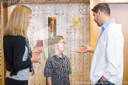Image of Optometrist Talking To Customers In Store