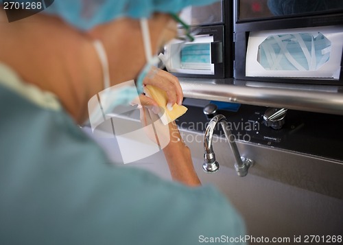Image of Doctor Washing Hands Before Surgery