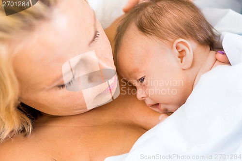 Image of Babygirl Resting On Mother