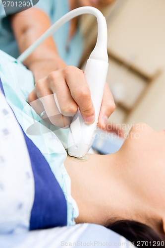 Image of Nurse Performing Ultrasound On Patient's Neck