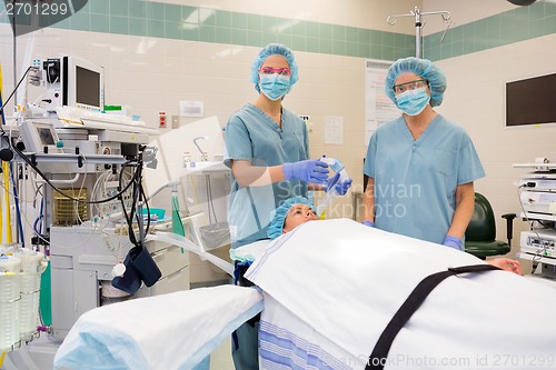 Image of Nurses With Oxygen Mask Preparing Patient