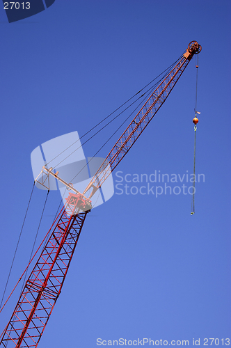 Image of Construction crane against blue sky