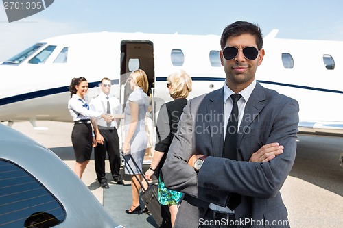 Image of Confident Young Businessman At Airport Terminal