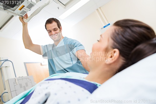 Image of Nurse Adjusting Xray Machine For Patient