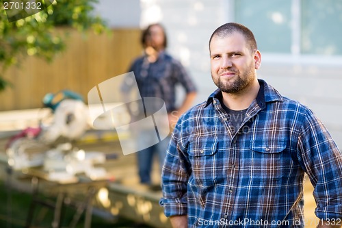 Image of Manual Worker In Casual Shirt At Construction Site