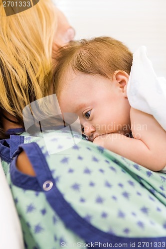 Image of Cute Babygirl Lying On Mother In Hospital