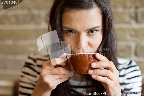 Image of Closeup Of Woman Drinking Coffee At Cafe