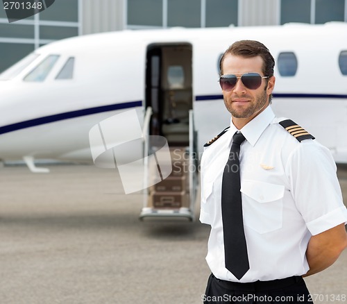 Image of Confident Pilot Wearing Sunglasses