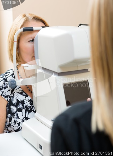 Image of Optometrist Using Tonometer to Measure Patients Eye Pressure