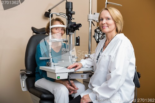 Image of Optometrist Examining Senior Patient's Eyes