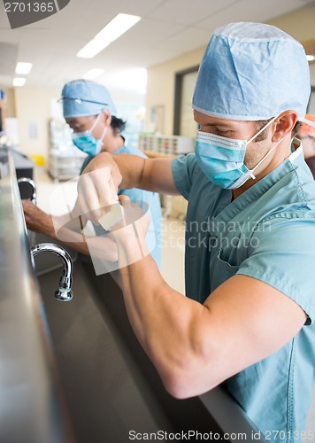 Image of Sterilizing Hands and Arms Before Surgery