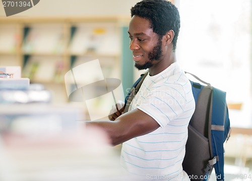 Image of Student Choosing Book At Library