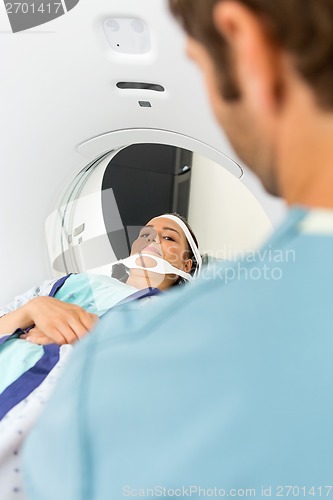 Image of Patient Looking At Nurse While Undergoing CT Scan