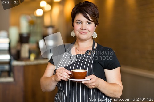 Image of Barista in Small Cafe
