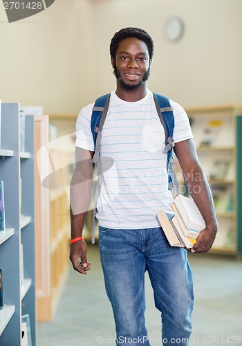 Image of Student With Backpack And Books In Bookstore
