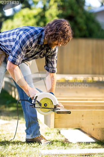 Image of Carpenter Using Circular Saw