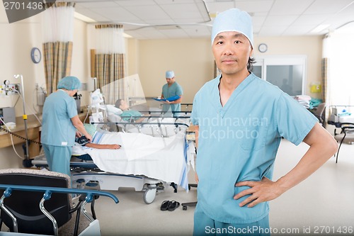 Image of Nurse Colleagues Examining Patient's In Ward