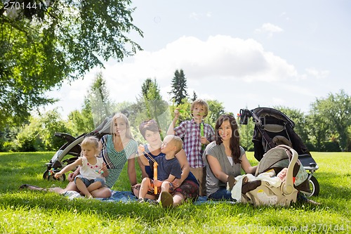 Image of Mothers And Children Enjoying Picnic