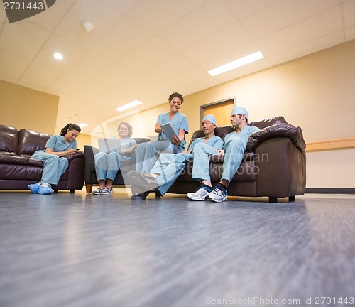 Image of Medical Team Using Technologies In Hospital's Waiting Room