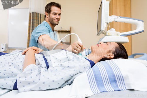 Image of Nurse Performing Ultrasound On Patient's Neck