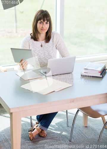 Image of Student Using Technologies In Library