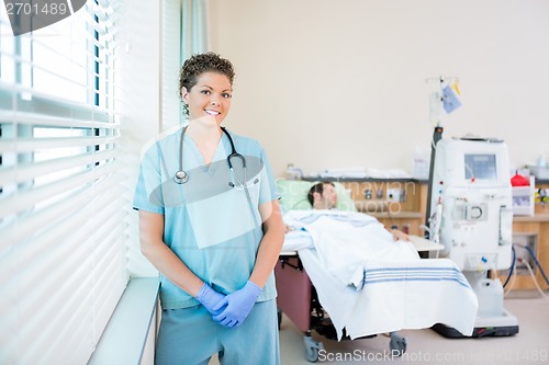 Image of Nurse With Patient Receiving Renal Dialysis In Hospital