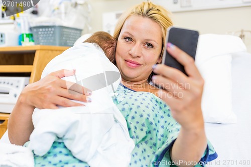 Image of Patient Taking Self Portrait With Babygirl Through Smart Phone