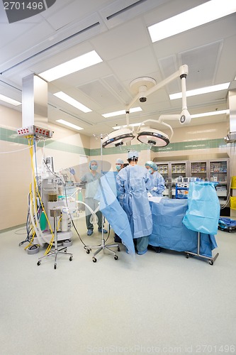 Image of Surgeons Operating Patient