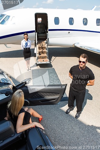 Image of Woman Stepping Out Of Car At Terminal