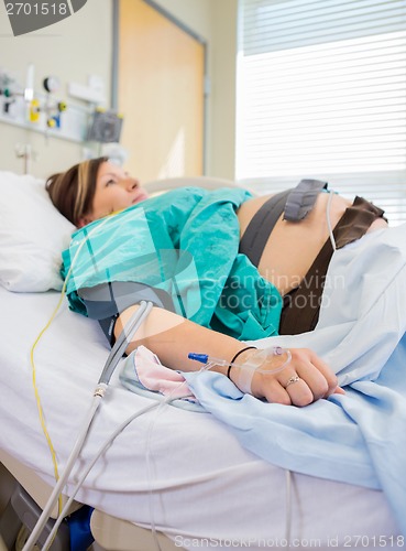 Image of Pregnant Woman With Fetal Monitoring Belts