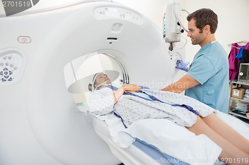 Image of Nurse Preparing Patient For CT Scan Test