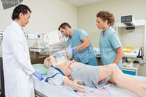 Image of Nurse Adjusting Endotracheal Tube On Dummy Patient