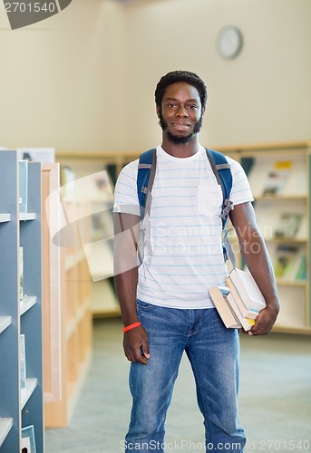 Image of Student With Books Standing In Bookstore