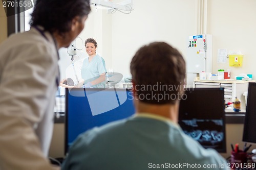 Image of Medical Team In CT Scan Lab