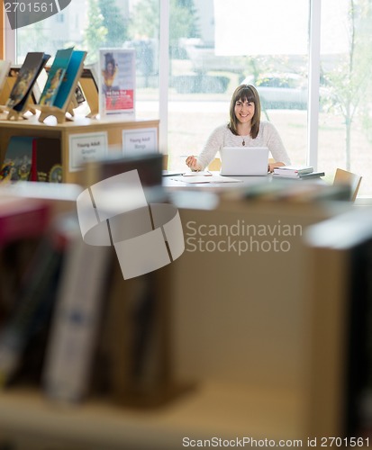 Image of Student With Laptop Studying In Library