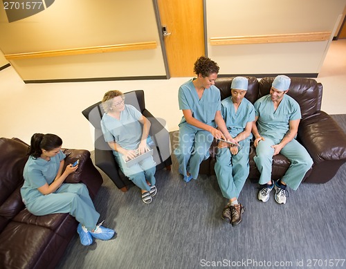 Image of Medical Team Using Technologies In Hospital's Waiting Room